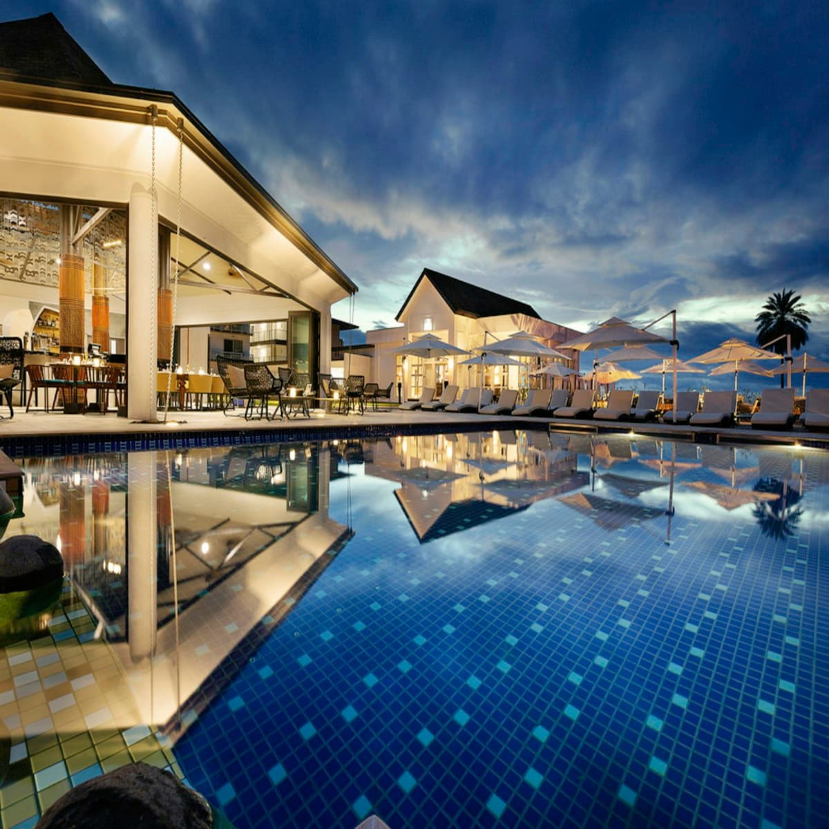 Elegant resort architecture beside a serene pool